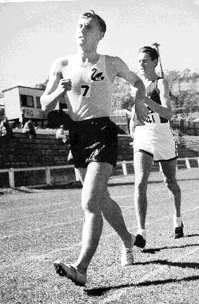 Ted Allsopp leads Don Keane in a track race